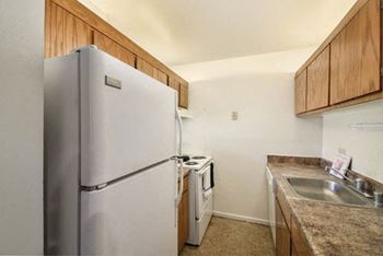 fully equipped kitchen with refrigerator