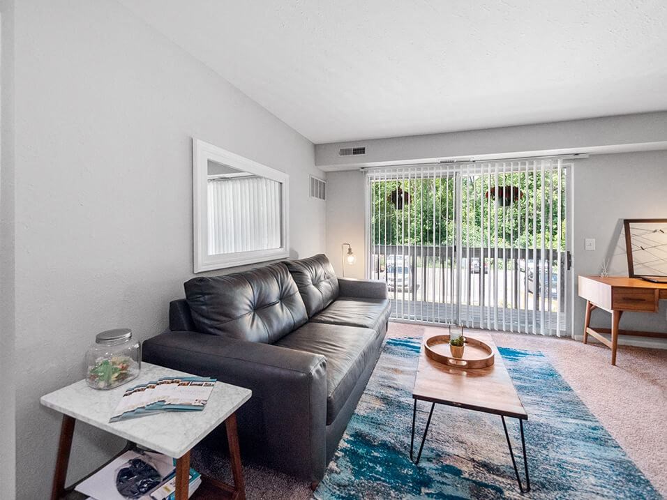 living room with patio/balcony connected