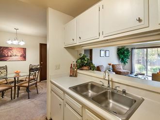kitchen with double sink and connected dining room
