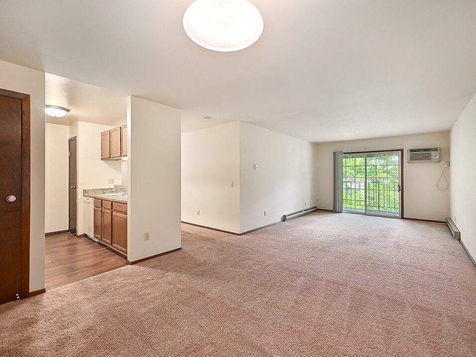 Living Room with connected balcony at river's edge apartments