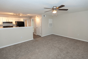 carpeted living rooms at residences at forestdale apartments
