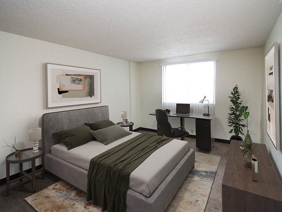 a bedroom with a bed and a desk