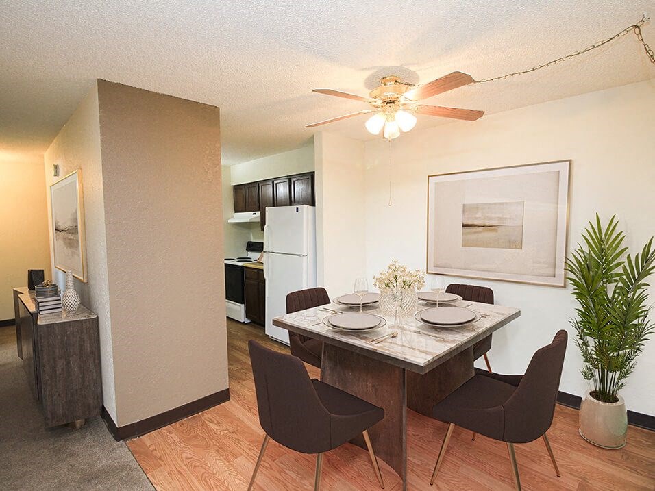 a dining and kitchen area with a table