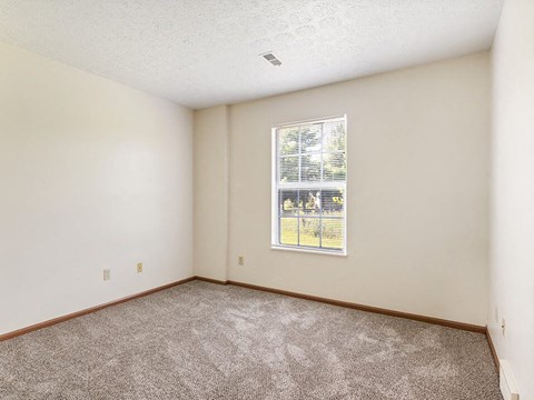 apartment bedroom with a big window