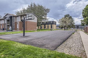 an empty parking lot in front of a building