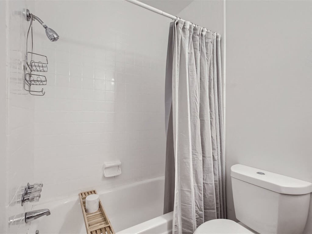 apartment bathroom with a bath tub