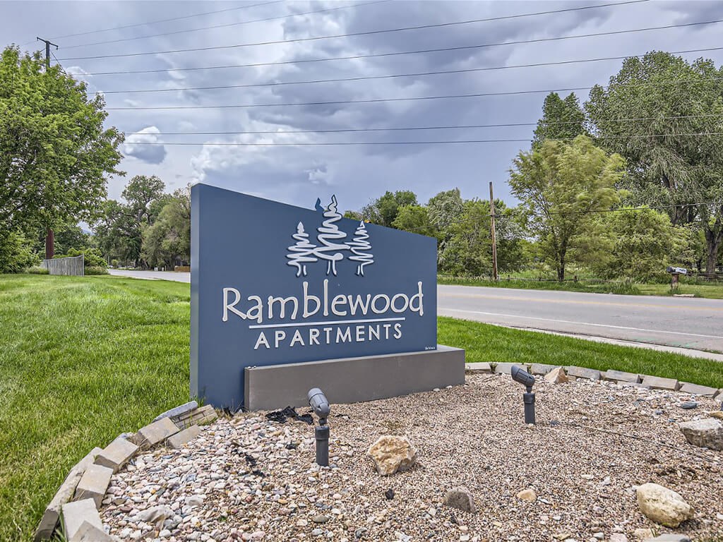 welcome sign for Ramblewood Apartments