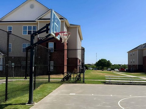 a basketball hoop in front of River Ranch Apartments