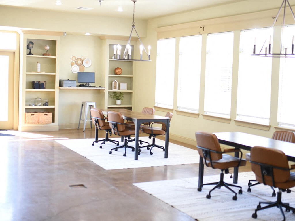 a dining room with a table and chairs