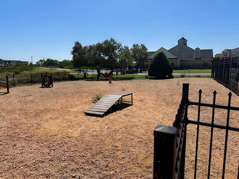 a dog park area at river ranch apartments in san angelo