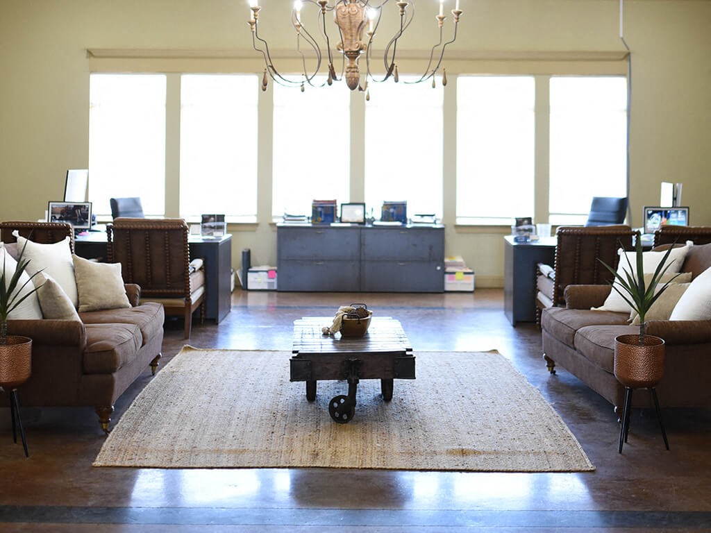 a living room with couches and a coffee table