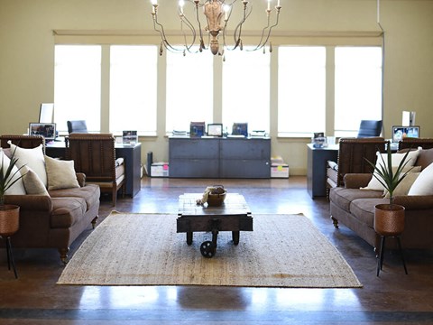a living room with couches and a coffee table