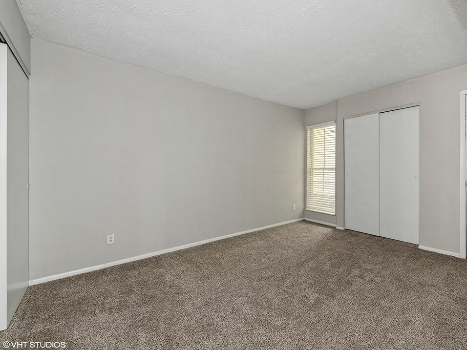 bedroom with a closet and a window