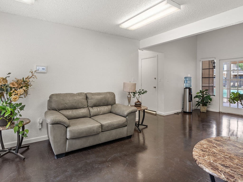 a living room with a couch and a table