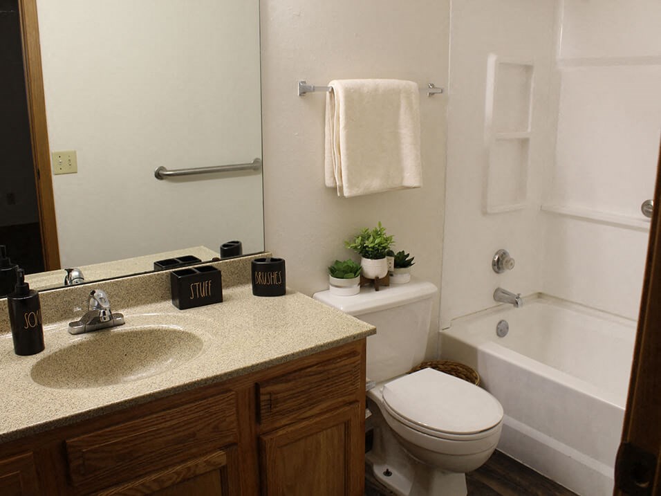 a bathroom with a toilet sink and bathtub