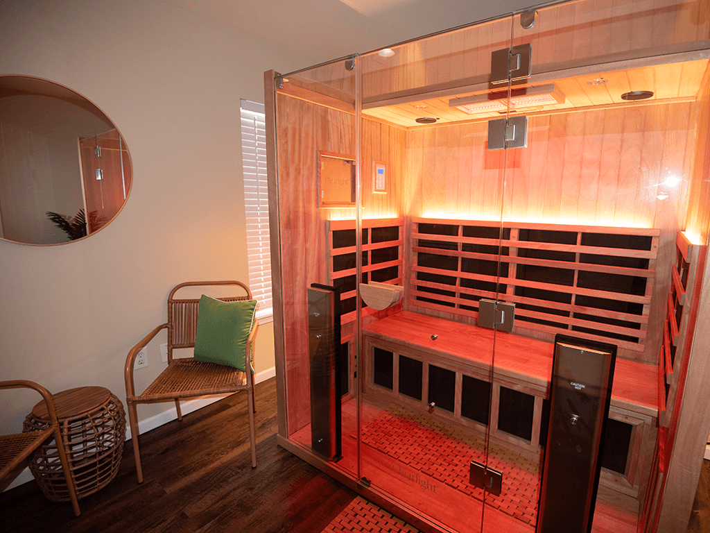 a sauna in a room with a glass door