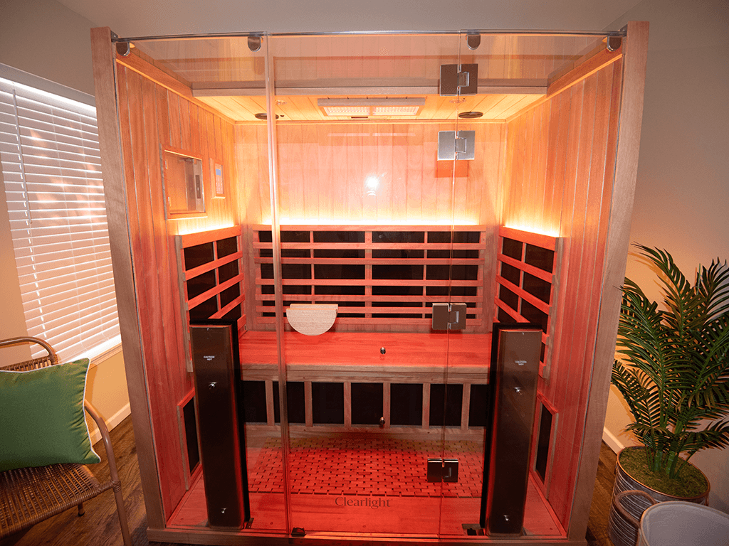 an infrared sauna is shown in a room with a plant