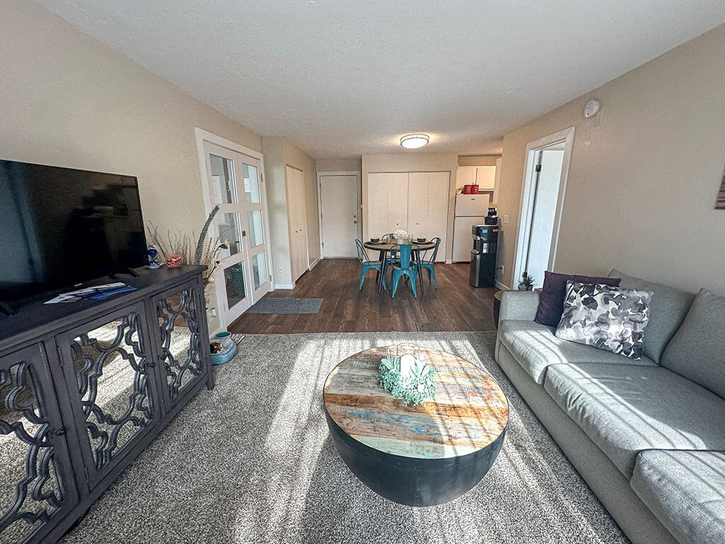 a living room with a couch and a table