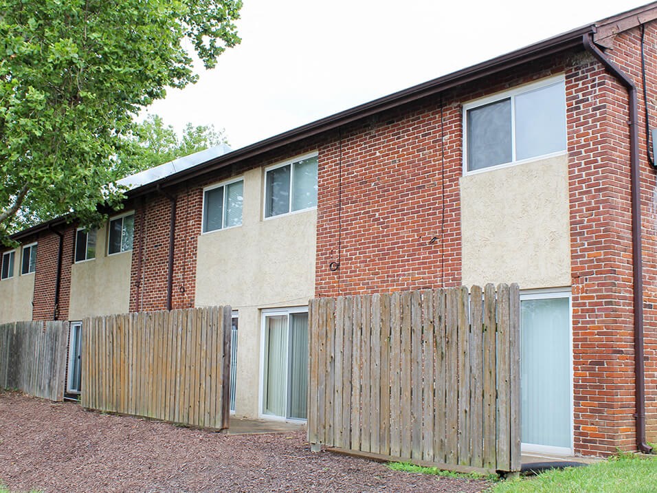 a brick building with a patio