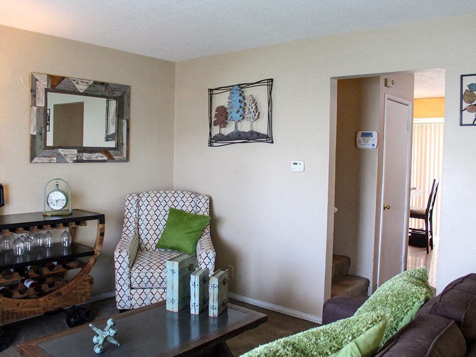 a living room with a couch and a chair