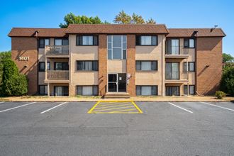 this is a picture of a parking lot in front of a building