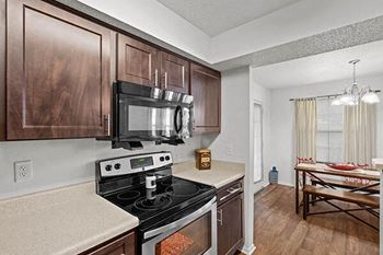 a kitchen with a stove and a microwave