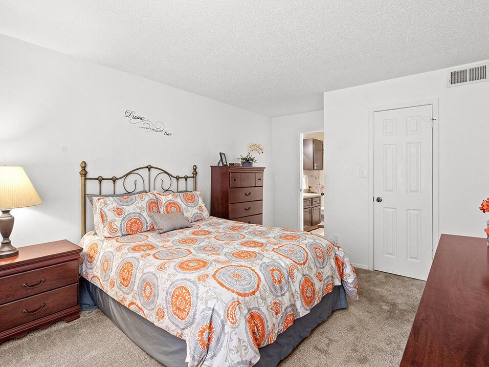 a bedroom with a bed and a closet