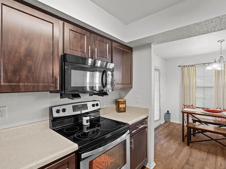 a kitchen with a stove and a microwave