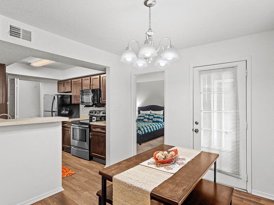 a kitchen and dining room with a table