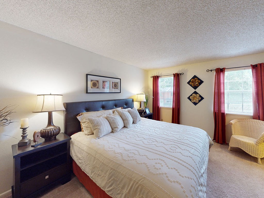 apartment bedroom with large windows
