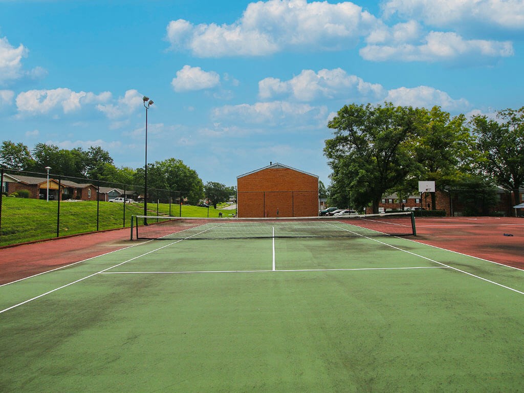 a tennis court at apartment complex