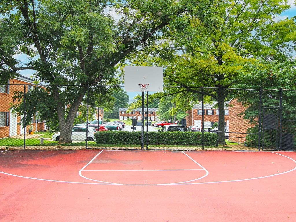 a basketball court at apartment complex