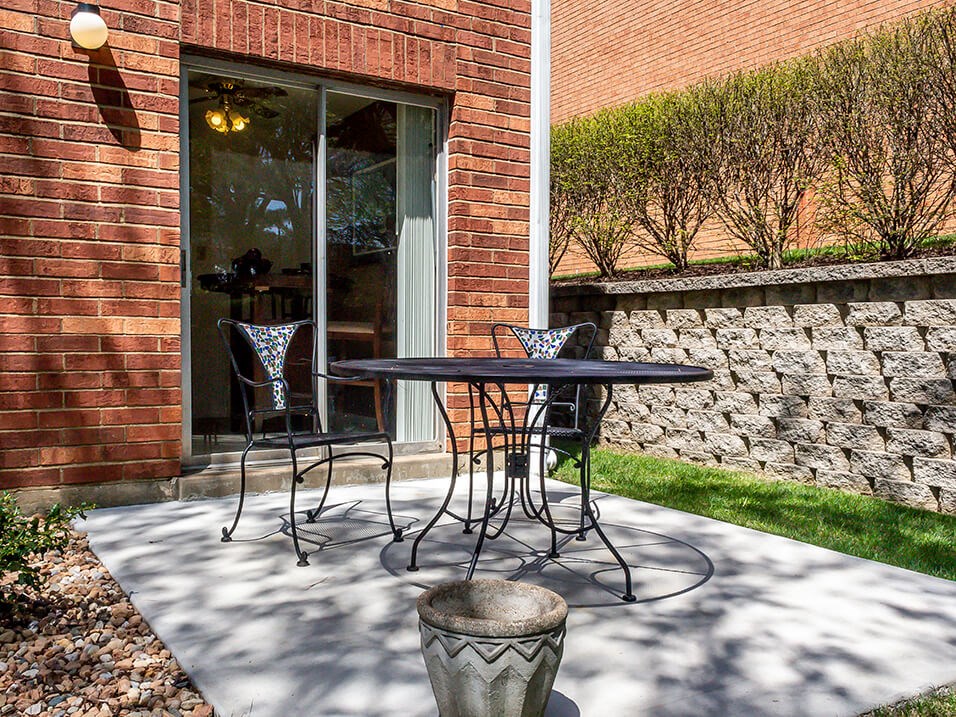 apartment patio with sliding glass doors