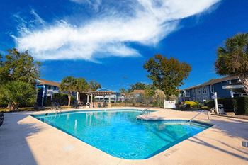 the swimming pool at the apartment on a sunny day