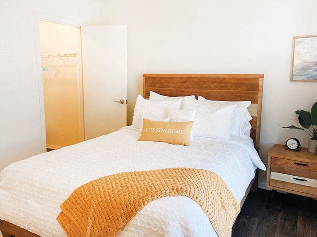 a bedroom with a bed and a pillow on it