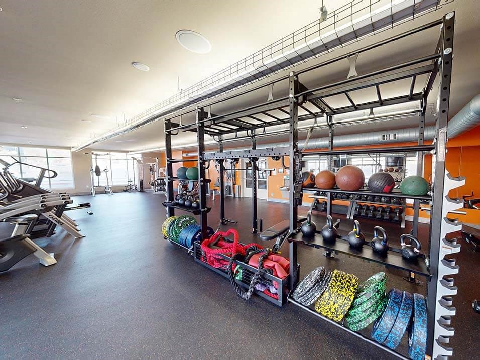 apartment gym with weights and other equipment