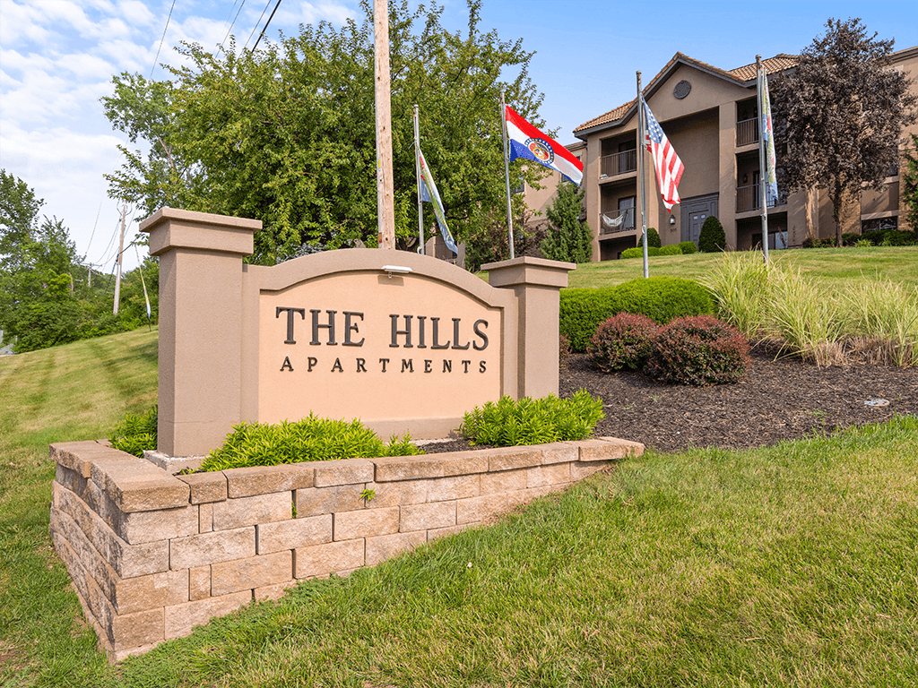 the Hills apartments welcome sign
