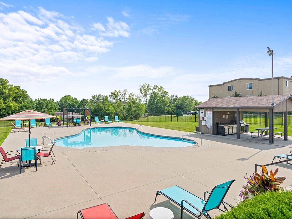 a swimming pool with grill station