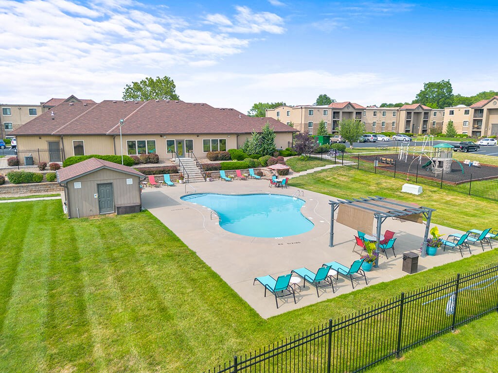 an aerial view of our apartments with an outdoor pool