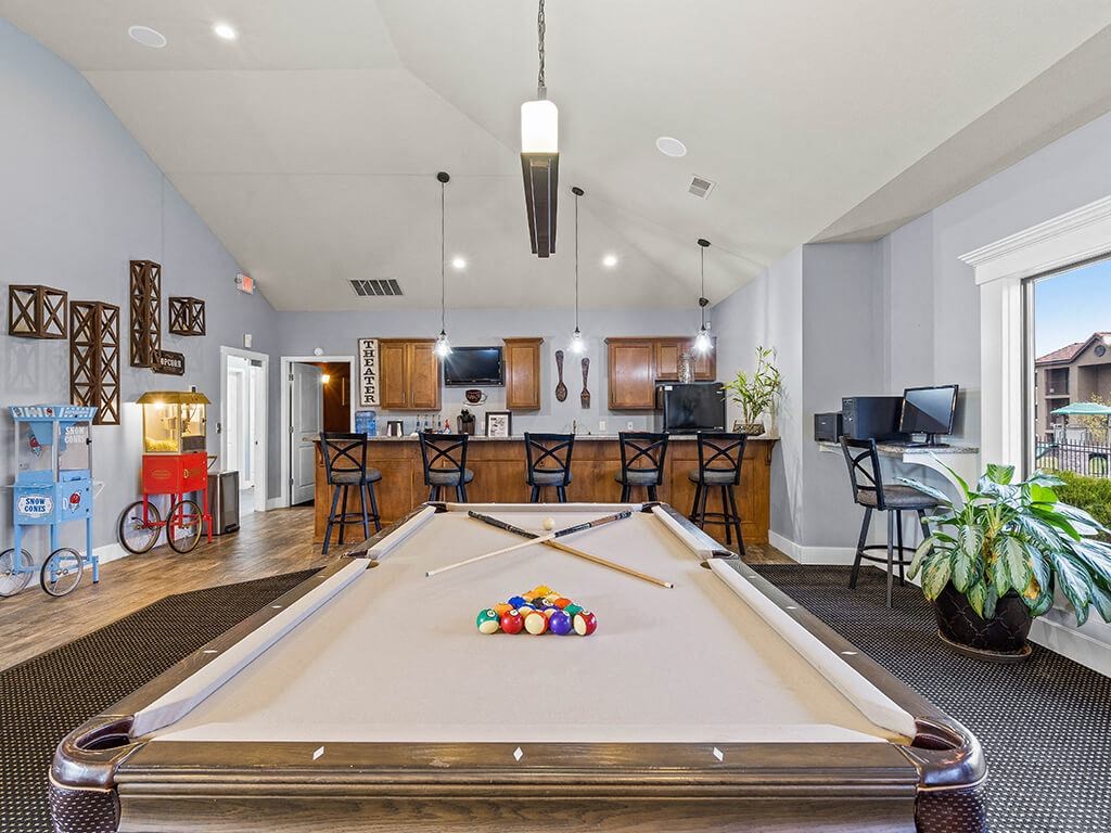 a game room with a pool table