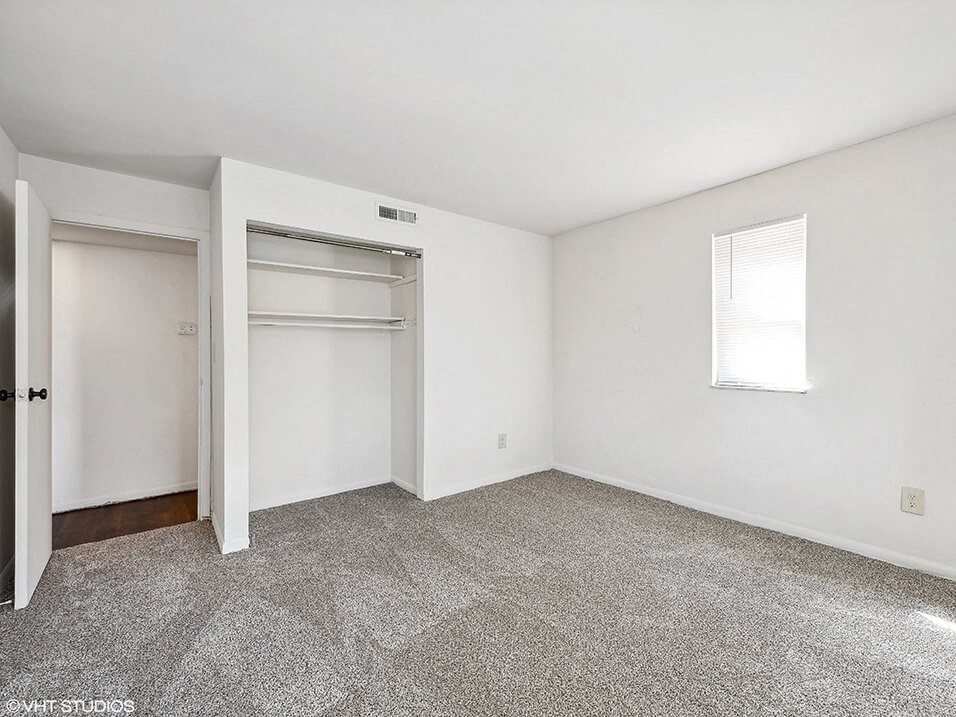 bedroom with a closet and a window