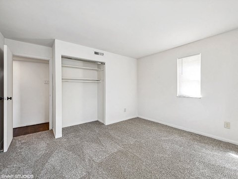 bedroom with a closet and a window