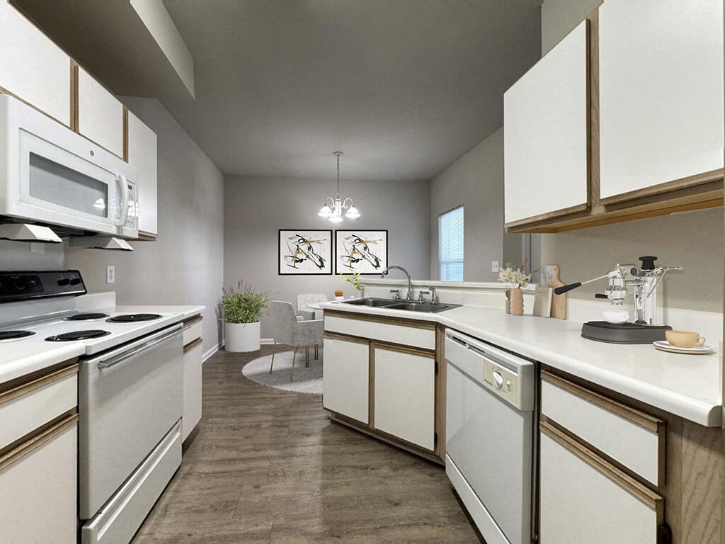 a kitchen with white cabinets and a counter top