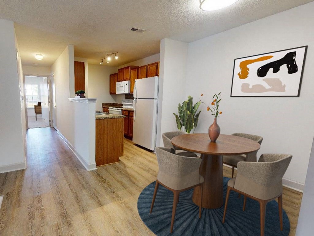 a dining room and kitchen with a table and chairs