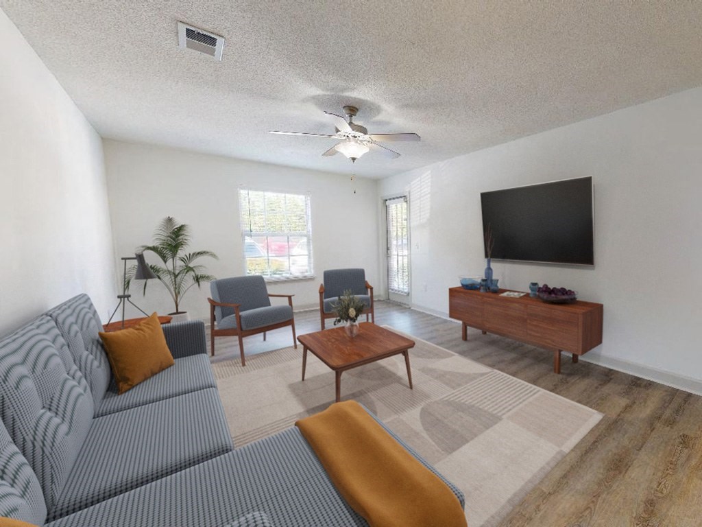 a living room with a couch and a tv