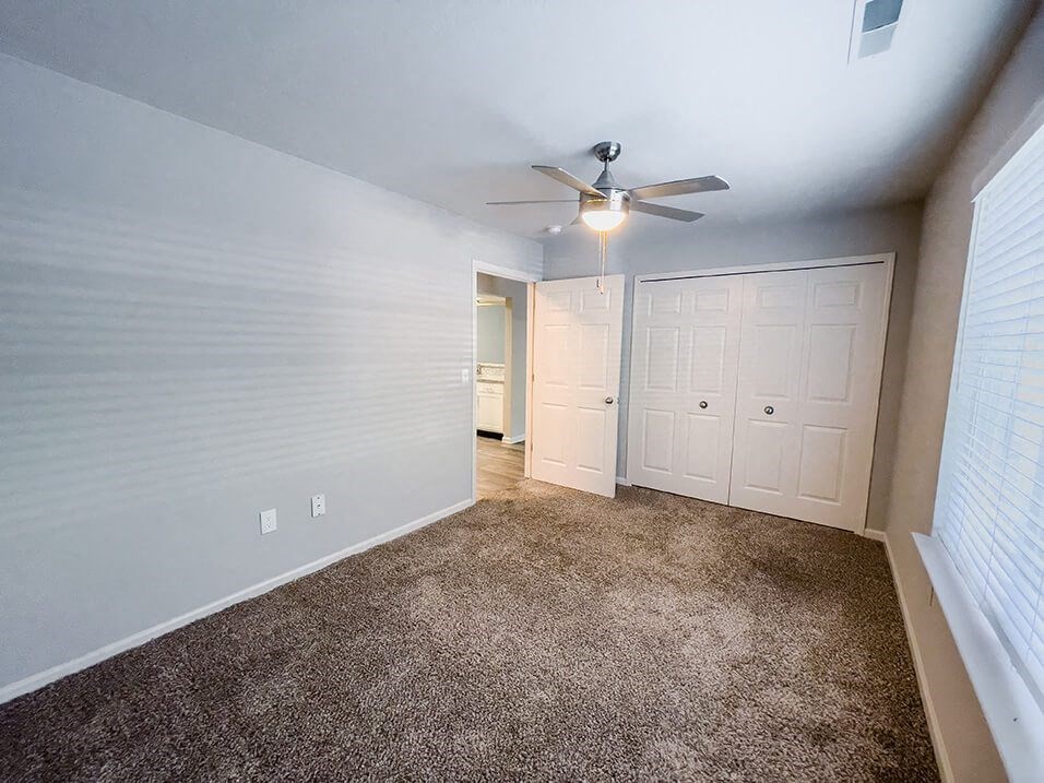 Bedroom at the plaza at lamberton with large closet and overhead light