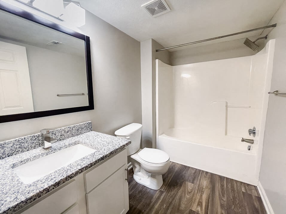Large Full-Bathroom with tub a good lighting at the plaza at lamberton