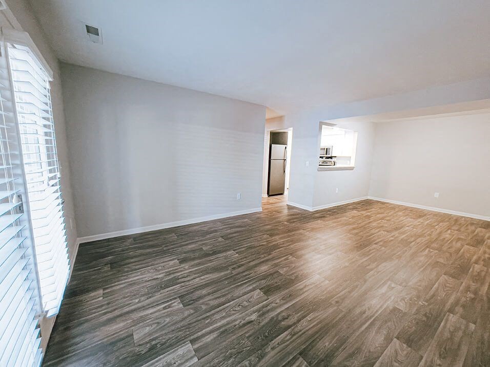 open living room with natural lighting at the plaza at lamberton 