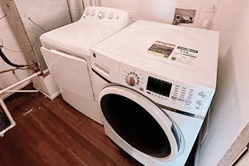a washing machine and a dryer in a laundry room in a townhome