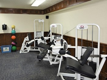 fitness equipment at tourville apartment gym - Photo Gallery 11
